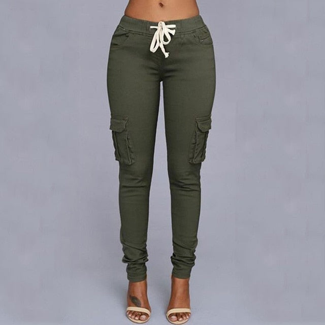 A woman wearing High Waist Jogger Pants in black color with pockets, elastic waistband and drawstring closure