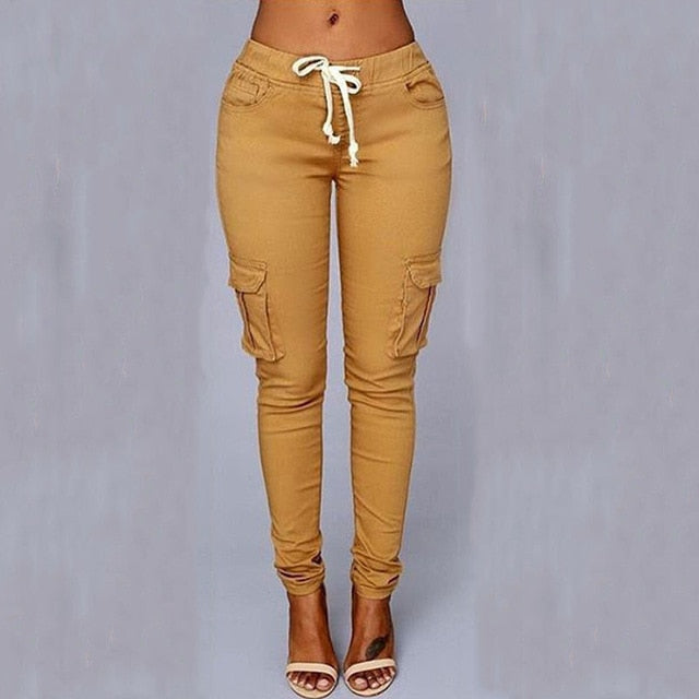 A woman wearing High Waist Jogger Pants in black color with pockets, elastic waistband and drawstring closure