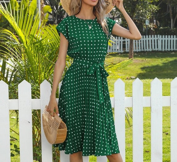 Image of Short Sleeve Polka Dot Dress made of polyester, perfect for casual parties or events. Features round neck, bandage decoration with pull-over closure, and ideal for warmer weather.