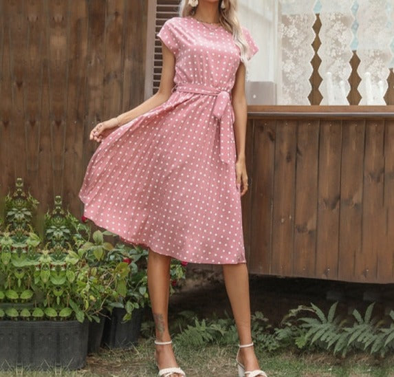 Image of Short Sleeve Polka Dot Dress made of polyester, perfect for casual parties or events. Features round neck, bandage decoration with pull-over closure, and ideal for warmer weather.
