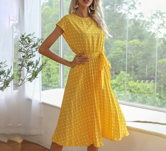 Image of Short Sleeve Polka Dot Dress made of polyester, perfect for casual parties or events. Features round neck, bandage decoration with pull-over closure, and ideal for warmer weather.