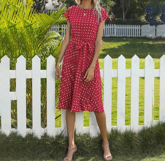 Image of Short Sleeve Polka Dot Dress made of polyester, perfect for casual parties or events. Features round neck, bandage decoration with pull-over closure, and ideal for warmer weather.
