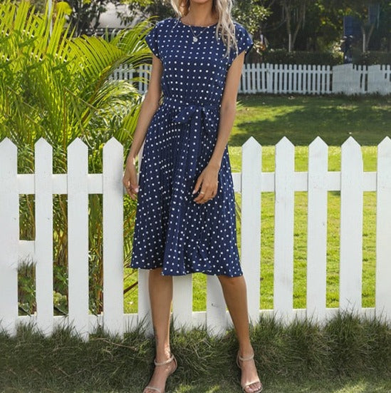 Image of Short Sleeve Polka Dot Dress made of polyester, perfect for casual parties or events. Features round neck, bandage decoration with pull-over closure, and ideal for warmer weather.