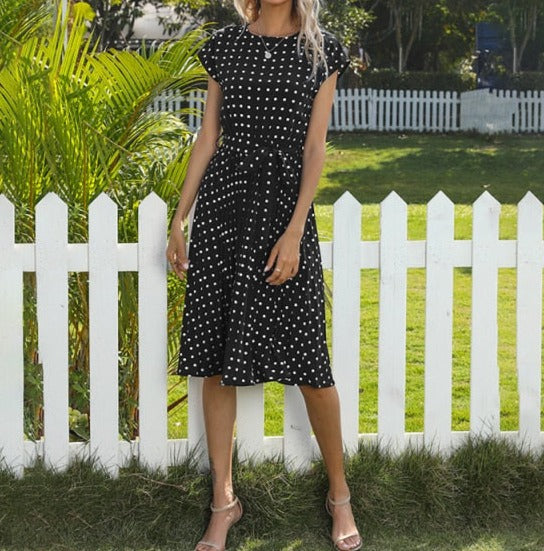 Image of Short Sleeve Polka Dot Dress made of polyester, perfect for casual parties or events. Features round neck, bandage decoration with pull-over closure, and ideal for warmer weather.