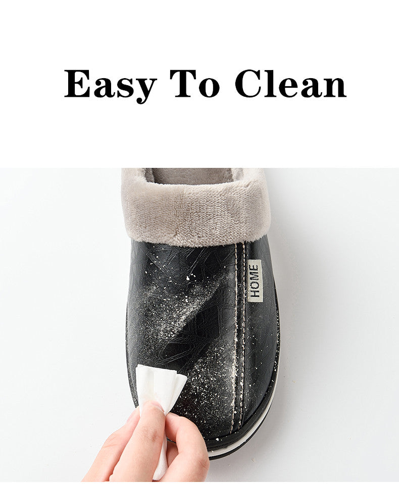 A pair of men's indoor slippers made of proportioned PU and plush insole material. The slippers are a light brown color and have a comfortable, relaxed design.