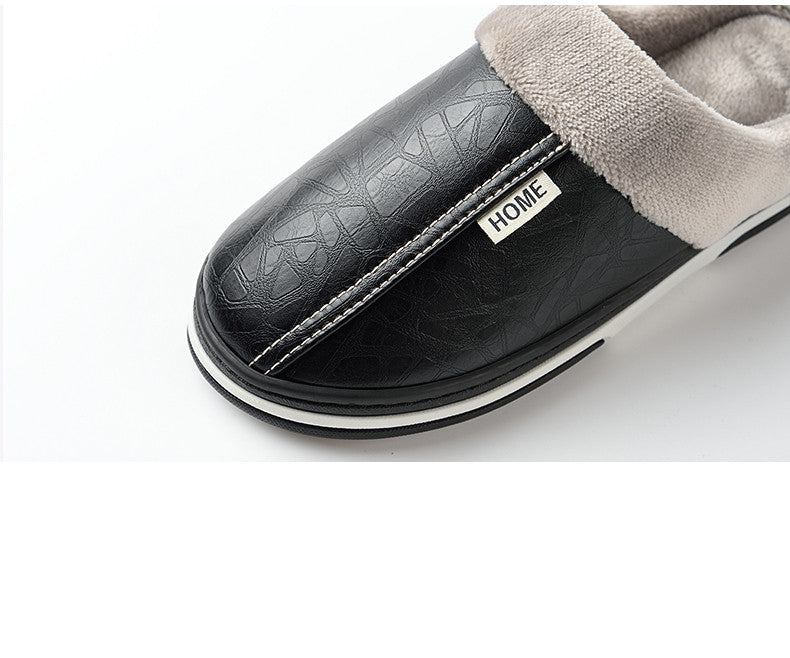 A pair of men's indoor slippers made of proportioned PU and plush insole material. The slippers are a light brown color and have a comfortable, relaxed design.