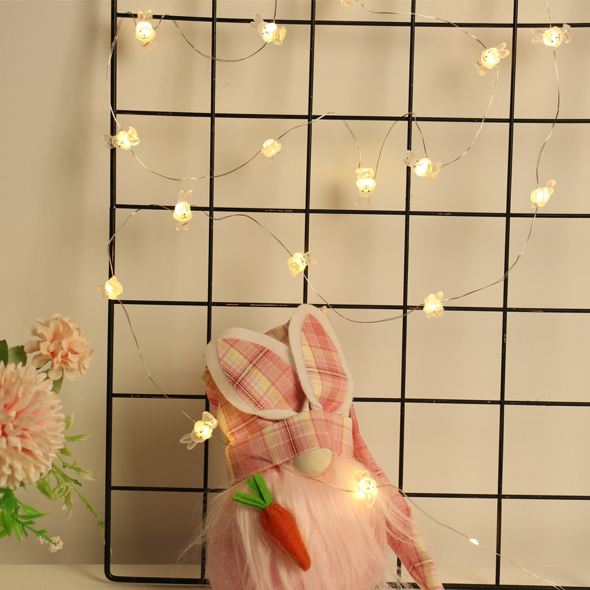 Add some spring cheer to your Easter decorations with our Easter LED Bunny String Lights! These festive lights are perfect for brightening up any space and impressing your guests. Hang them in a variety of ways - from walls to flower pots to mantelpieces - and watch your decor come to life. Don't miss out on this fun and versatile decoration. Shop now and light up your Easter!