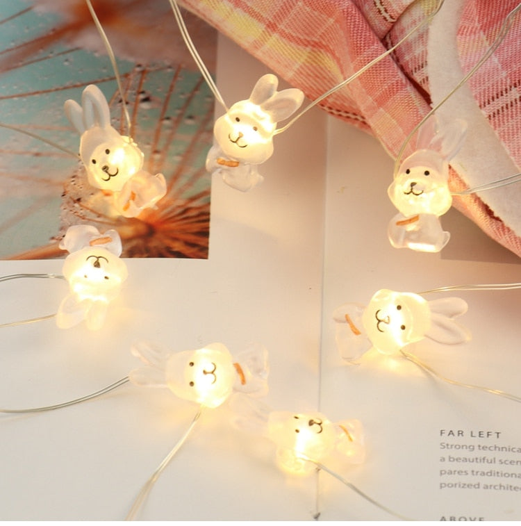 Add some spring cheer to your Easter decorations with our Easter LED Bunny String Lights! These festive lights are perfect for brightening up any space and impressing your guests. Hang them in a variety of ways - from walls to flower pots to mantelpieces - and watch your decor come to life. Don't miss out on this fun and versatile decoration. Shop now and light up your Easter!
