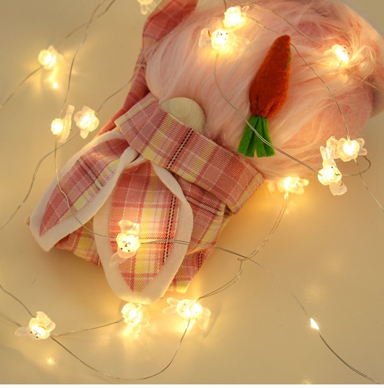 Add some spring cheer to your Easter decorations with our Easter LED Bunny String Lights! These festive lights are perfect for brightening up any space and impressing your guests. Hang them in a variety of ways - from walls to flower pots to mantelpieces - and watch your decor come to life. Don't miss out on this fun and versatile decoration. Shop now and light up your Easter!