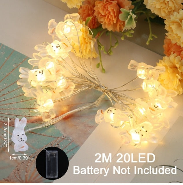 Add some spring cheer to your Easter decorations with our Easter LED Bunny String Lights! These festive lights are perfect for brightening up any space and impressing your guests. Hang them in a variety of ways - from walls to flower pots to mantelpieces - and watch your decor come to life. Don't miss out on this fun and versatile decoration. Shop now and light up your Easter!