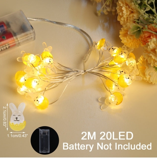 Add some spring cheer to your Easter decorations with our Easter LED Bunny String Lights! These festive lights are perfect for brightening up any space and impressing your guests. Hang them in a variety of ways - from walls to flower pots to mantelpieces - and watch your decor come to life. Don't miss out on this fun and versatile decoration. Shop now and light up your Easter!