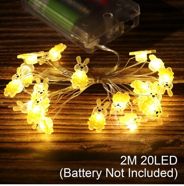 Add some spring cheer to your Easter decorations with our Easter LED Bunny String Lights! These festive lights are perfect for brightening up any space and impressing your guests. Hang them in a variety of ways - from walls to flower pots to mantelpieces - and watch your decor come to life. Don't miss out on this fun and versatile decoration. Shop now and light up your Easter!