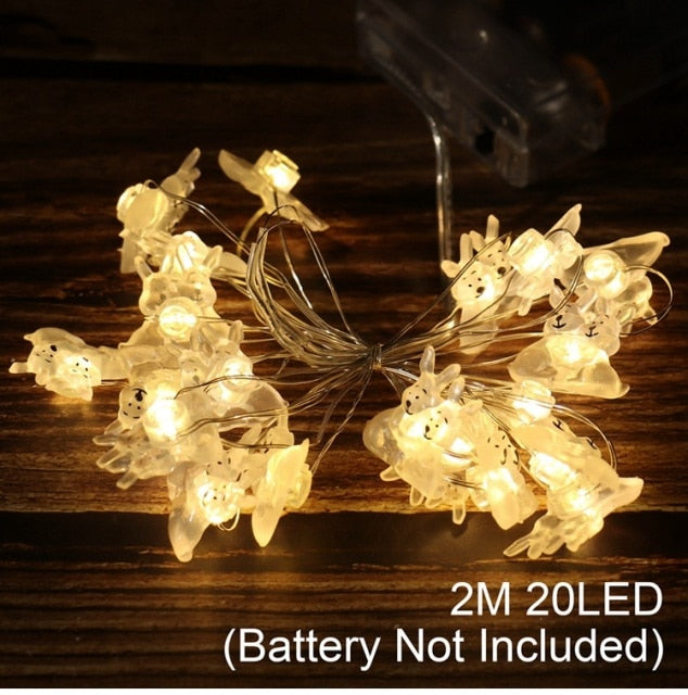 Add some spring cheer to your Easter decorations with our Easter LED Bunny String Lights! These festive lights are perfect for brightening up any space and impressing your guests. Hang them in a variety of ways - from walls to flower pots to mantelpieces - and watch your decor come to life. Don't miss out on this fun and versatile decoration. Shop now and light up your Easter!