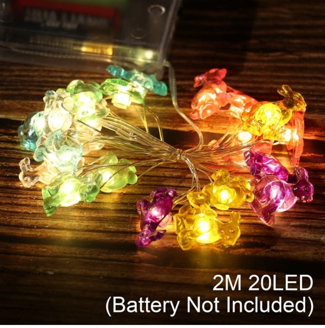 Add some spring cheer to your Easter decorations with our Easter LED Bunny String Lights! These festive lights are perfect for brightening up any space and impressing your guests. Hang them in a variety of ways - from walls to flower pots to mantelpieces - and watch your decor come to life. Don't miss out on this fun and versatile decoration. Shop now and light up your Easter!