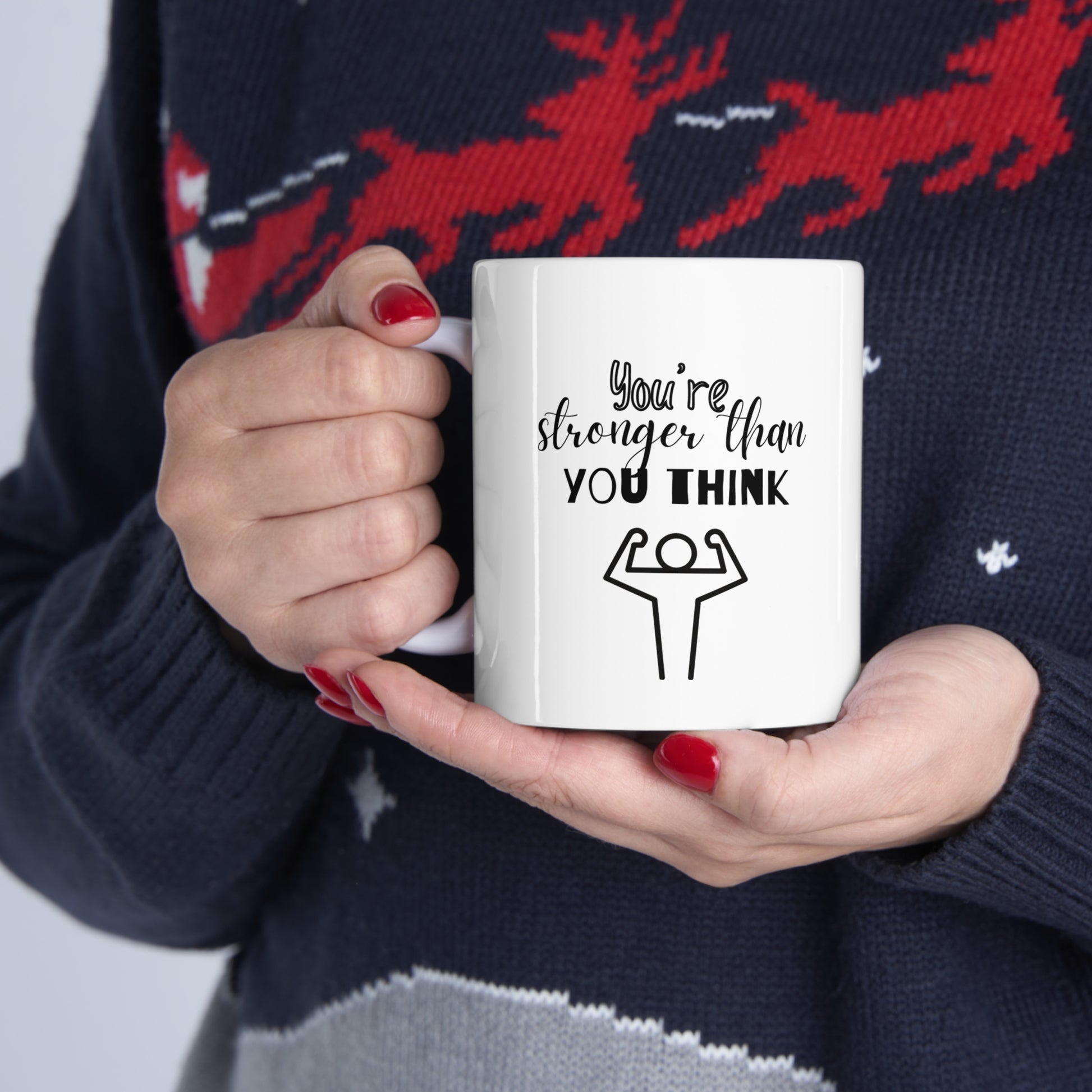 Custom-designed ceramic mug with "You're Stronger than You Think" design, 11 oz capacity.