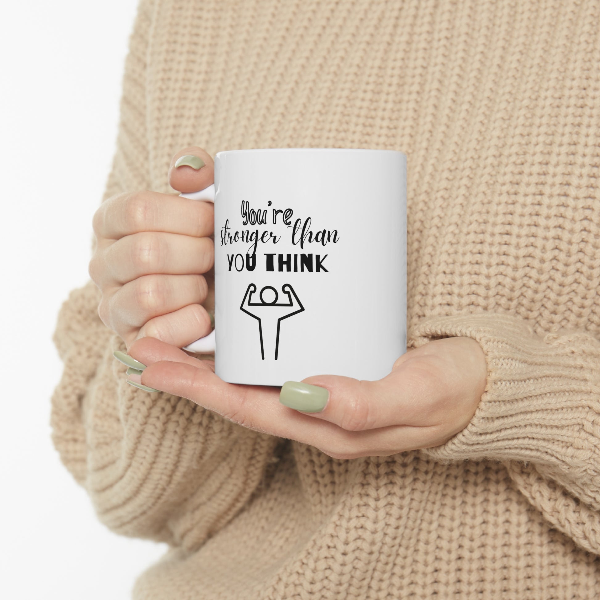 Custom-designed ceramic mug with "You're Stronger than You Think" design, 11 oz capacity.