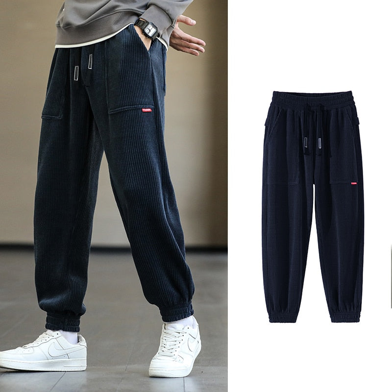 Men's Autumn Corduroy Sweatpants - Comfortable midweight design with drawstring closure. Available in sizes M to 8XL, in colors like Black, Blue, Grey, White, Yellow, and Brown. Perfect for autumn and winter.