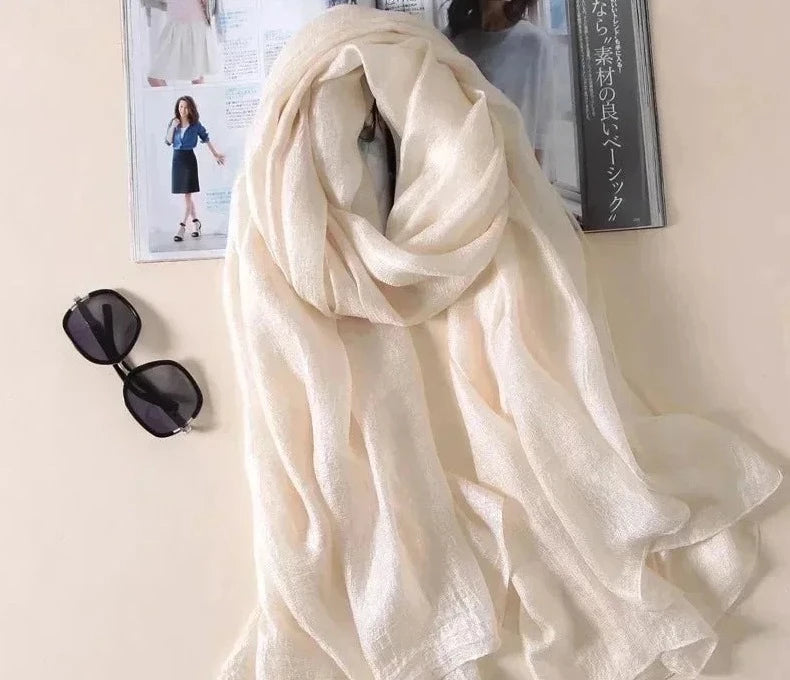 Image of Spring and Summer Linen Beach Scarf, a high-quality linen scarf perfect for beach outings. Versatile in style, it can be worn as both a scarf and a shawl.