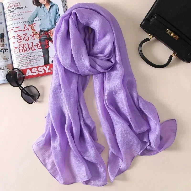 Image of Spring and Summer Linen Beach Scarf, a high-quality linen scarf perfect for beach outings. Versatile in style, it can be worn as both a scarf and a shawl.