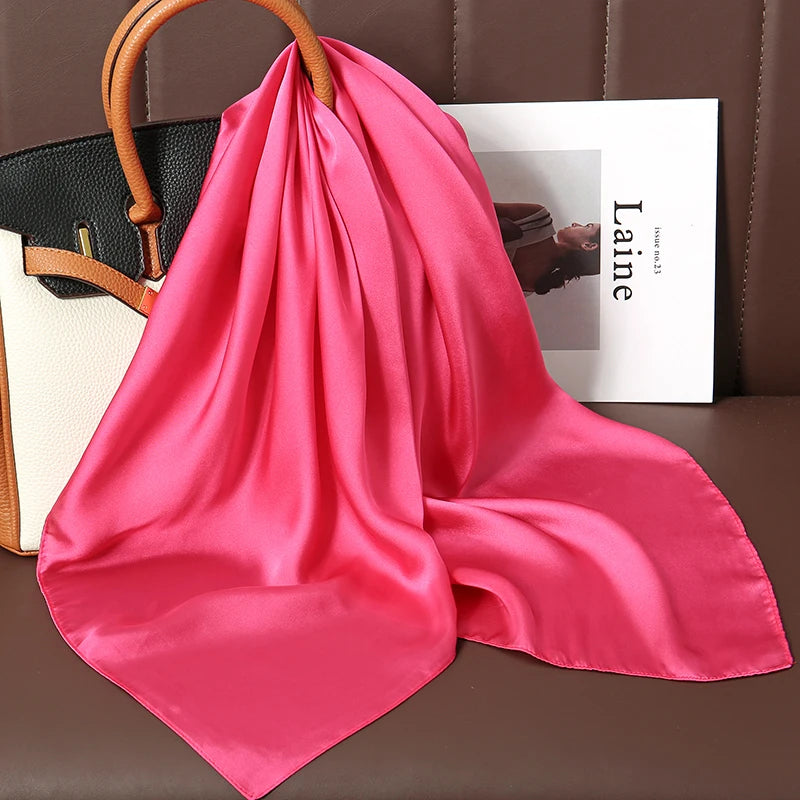 Image of Sophisticated Silk Satin Hijab Scarf, a polyester scarf with sun protection features, measuring 70cm x 70cm, and available in six colors. Perfect for spring and summer outings.