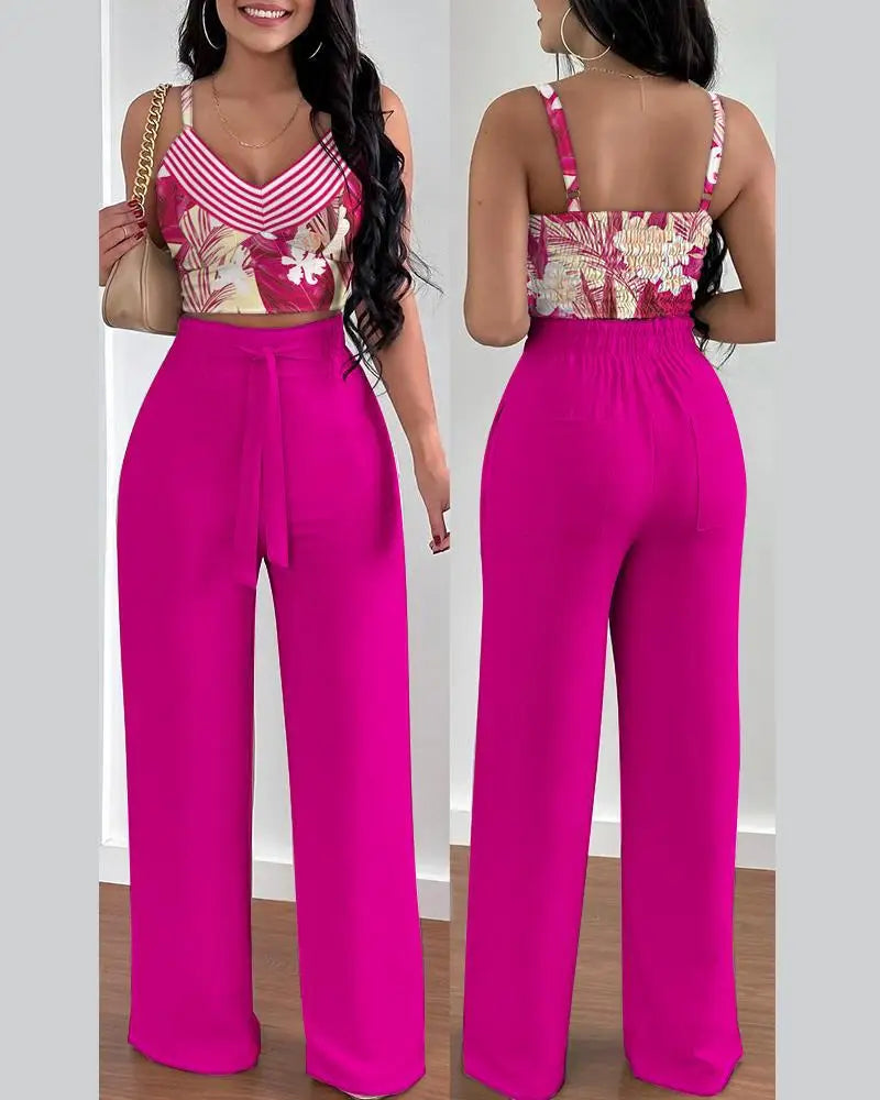 Summer Printed Two-Piece Set with V-neck sleeveless crop top and high-waist wide-leg pants. Made from blended POLYESTER fabric with lace-up decoration. Chic and comfortable summer fashion for women aged 18-24.