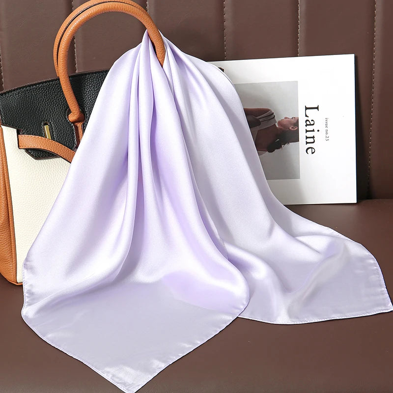 Image of Sophisticated Silk Satin Hijab Scarf, a polyester scarf with sun protection features, measuring 70cm x 70cm, and available in six colors. Perfect for spring and summer outings.