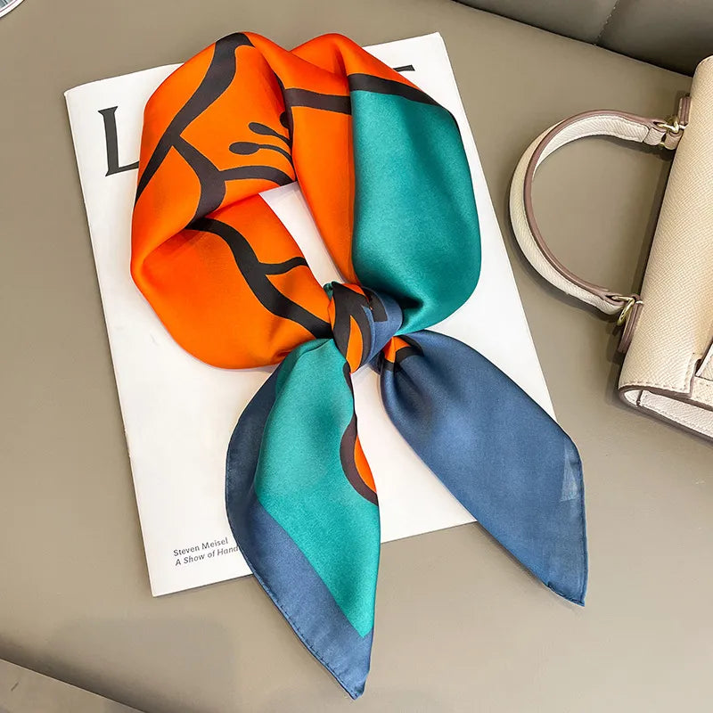 Image of Sophisticated Silk Satin Hijab Scarf, a polyester scarf with sun protection features, measuring 70cm x 70cm, and available in six colors. Perfect for spring and summer outings.