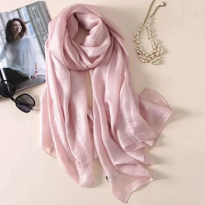 Image of Spring and Summer Linen Beach Scarf, a high-quality linen scarf perfect for beach outings. Versatile in style, it can be worn as both a scarf and a shawl.