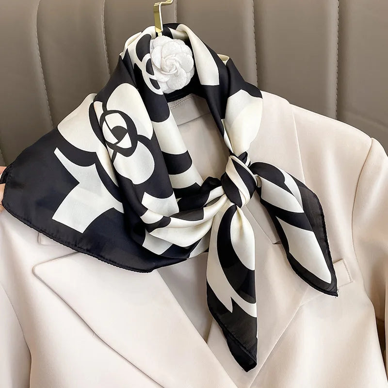 Image of Sophisticated Silk Satin Hijab Scarf, a polyester scarf with sun protection features, measuring 70cm x 70cm, and available in six colors. Perfect for spring and summer outings.