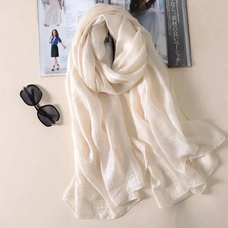 Image of Spring and Summer Linen Beach Scarf, a high-quality linen scarf perfect for beach outings. Versatile in style, it can be worn as both a scarf and a shawl.