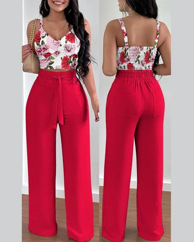 Summer Printed Two-Piece Set with V-neck sleeveless crop top and high-waist wide-leg pants. Made from blended POLYESTER fabric with lace-up decoration. Chic and comfortable summer fashion for women aged 18-24.