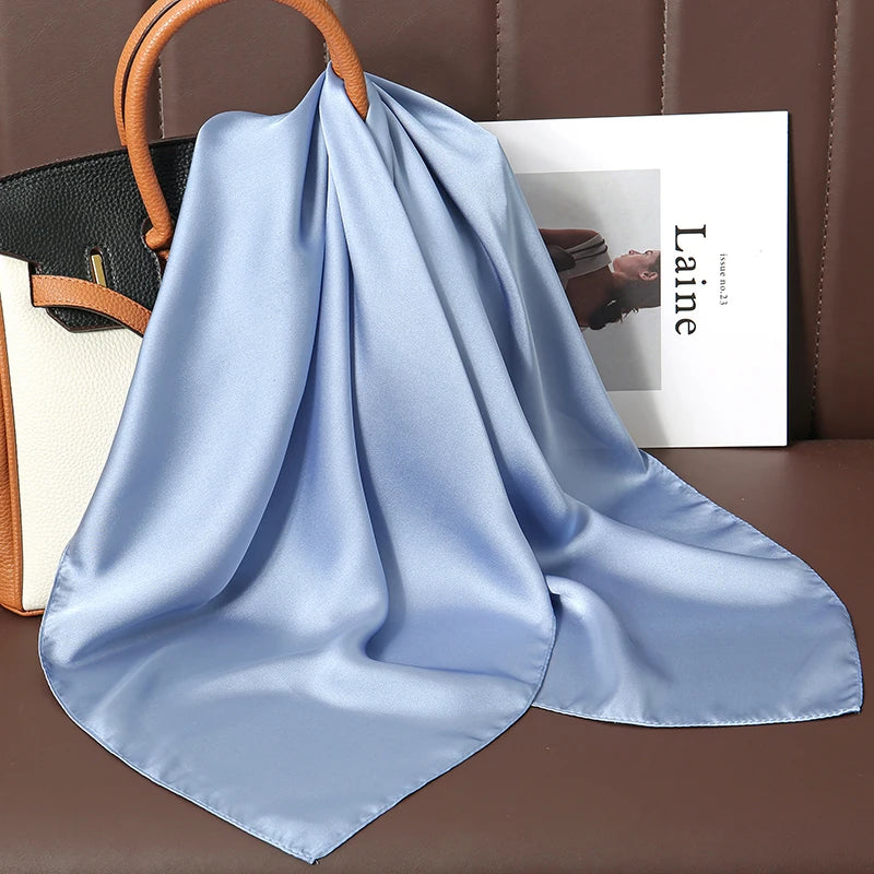 Image of Sophisticated Silk Satin Hijab Scarf, a polyester scarf with sun protection features, measuring 70cm x 70cm, and available in six colors. Perfect for spring and summer outings.