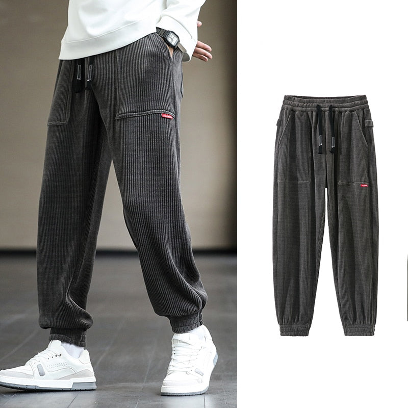 Men's Autumn Corduroy Sweatpants - Comfortable midweight design with drawstring closure. Available in sizes M to 8XL, in colors like Black, Blue, Grey, White, Yellow, and Brown. Perfect for autumn and winter.