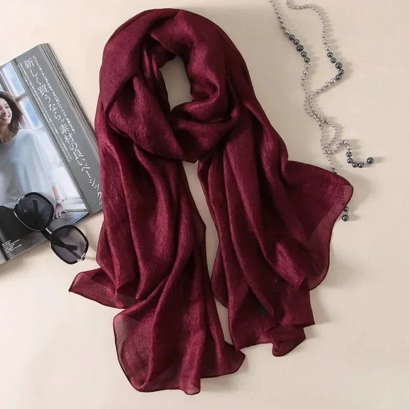 Image of Spring and Summer Linen Beach Scarf, a high-quality linen scarf perfect for beach outings. Versatile in style, it can be worn as both a scarf and a shawl.