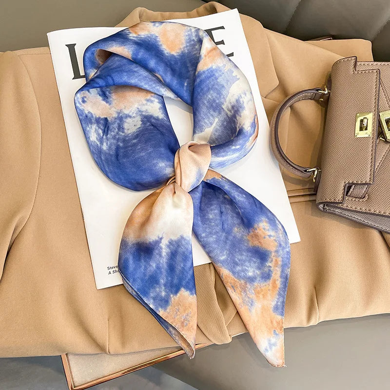 Image of Sophisticated Silk Satin Hijab Scarf, a polyester scarf with sun protection features, measuring 70cm x 70cm, and available in six colors. Perfect for spring and summer outings.