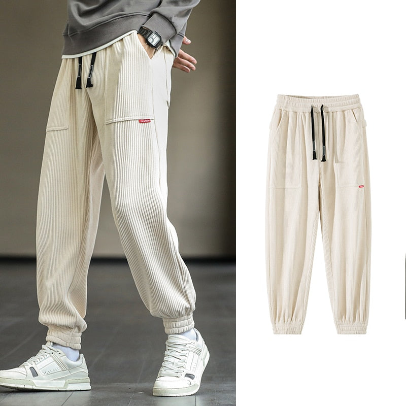 Men's Autumn Corduroy Sweatpants - Comfortable midweight design with drawstring closure. Available in sizes M to 8XL, in colors like Black, Blue, Grey, White, Yellow, and Brown. Perfect for autumn and winter.