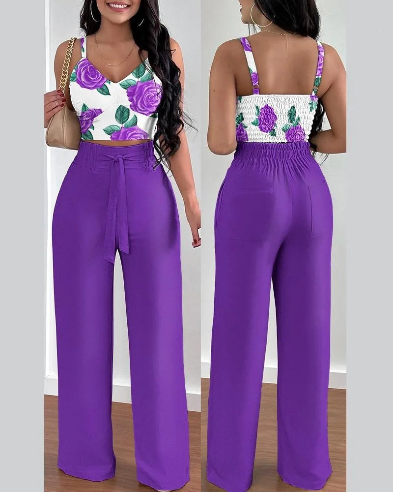 Summer Printed Two-Piece Set with V-neck sleeveless crop top and high-waist wide-leg pants. Made from blended POLYESTER fabric with lace-up decoration. Chic and comfortable summer fashion for women aged 18-24.