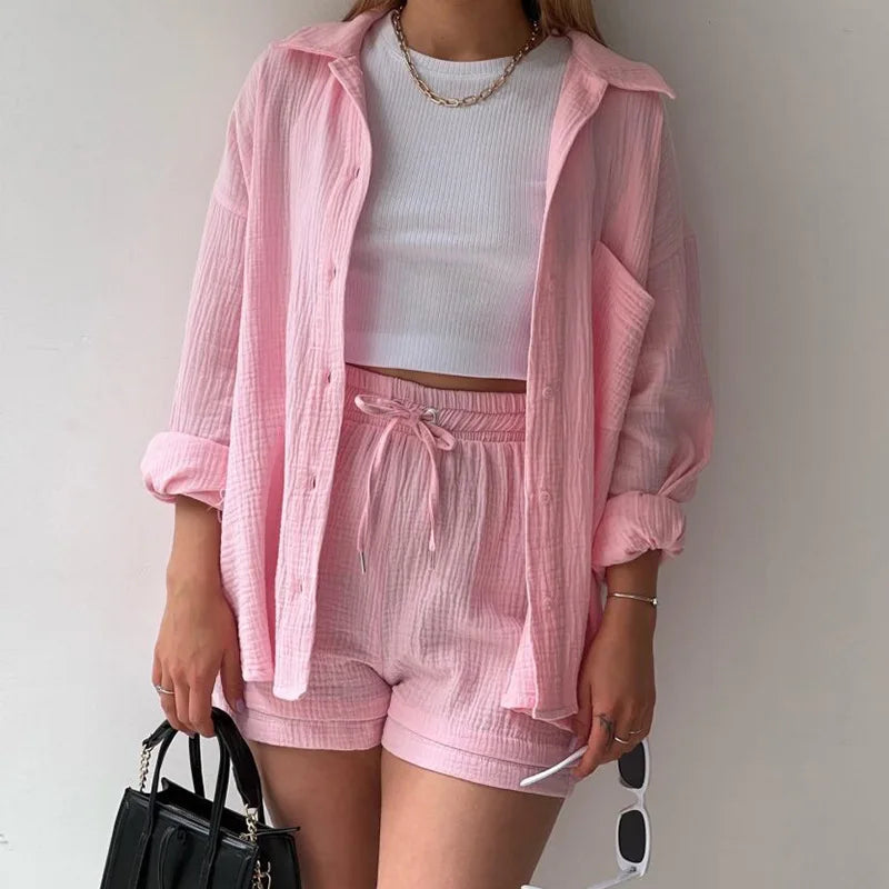 Two-Piece Buttoned Short Set for Women - Casual polo-neck top and knee-length pants set made from high-quality cotton fabric. Perfect for spring/summer 2024.