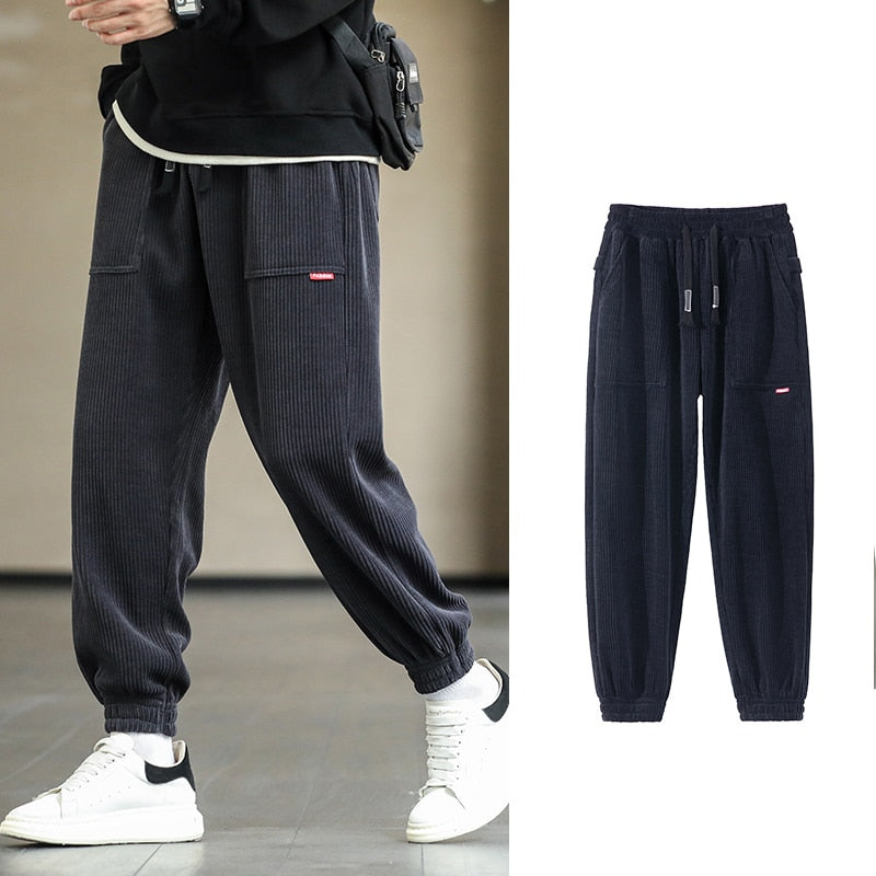 Men's Autumn Corduroy Sweatpants - Comfortable midweight design with drawstring closure. Available in sizes M to 8XL, in colors like Black, Blue, Grey, White, Yellow, and Brown. Perfect for autumn and winter.