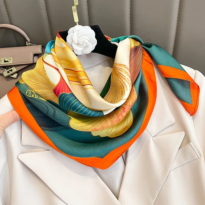 Image of Sophisticated Silk Satin Hijab Scarf, a polyester scarf with sun protection features, measuring 70cm x 70cm, and available in six colors. Perfect for spring and summer outings.