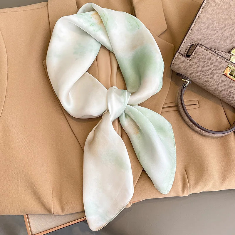 Image of Sophisticated Silk Satin Hijab Scarf, a polyester scarf with sun protection features, measuring 70cm x 70cm, and available in six colors. Perfect for spring and summer outings.