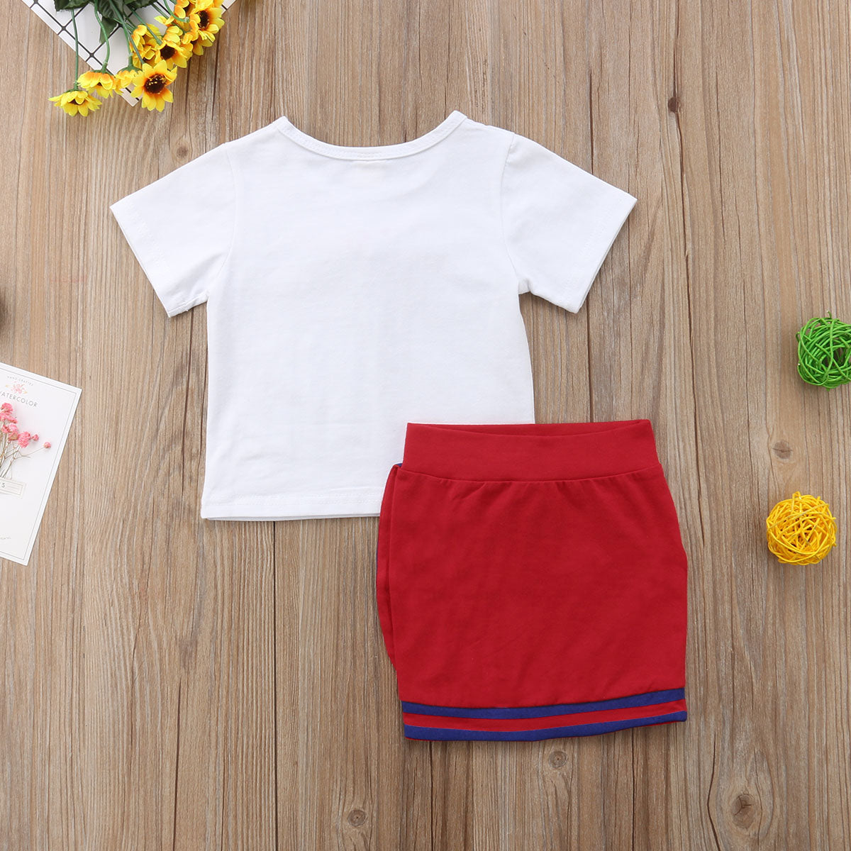  Image of Mini Skirt Set - Adorable and comfortable outfit for little girls. Made with high-quality cotton. Perfect for playtime and looking cute. Fits true to size. Let your little one shine in this fashionable set!