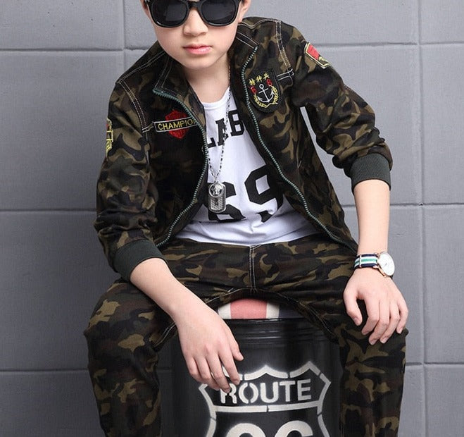 Boy wearing camouflage long-sleeve and pants set, made of cotton for comfort. Perfect for the classroom and playground. Please check our sizing chart for accurate measurements.