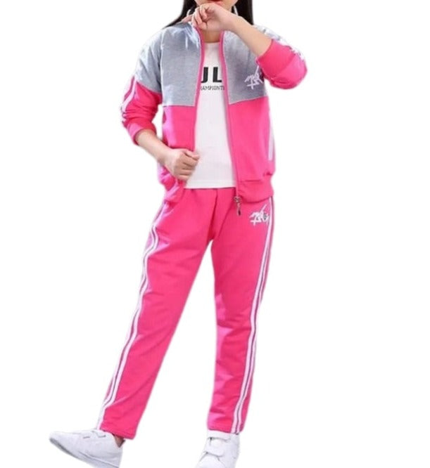 A young girl wearing a jacket and pants set. The jacket is made of a soft, comfortable material and the pants are made of a durable fabric. The set comes in a variety of colors and sizes to fit girls of all ages.