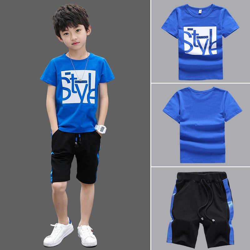 Image of a boy wearing a sports shirt and shorts in a fun design. Made from breathable cotton and polyester for comfort and durability during outdoor play and school sports activities.