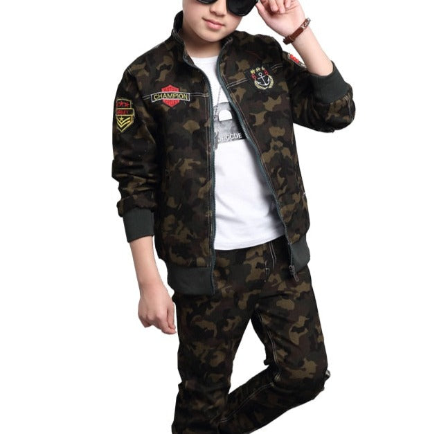 Boy wearing camouflage long-sleeve and pants set, made of cotton for comfort. Perfect for the classroom and playground. Please check our sizing chart for accurate measurements.