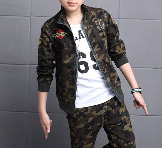 Boy wearing camouflage long-sleeve and pants set, made of cotton for comfort. Perfect for the classroom and playground. Please check our sizing chart for accurate measurements.