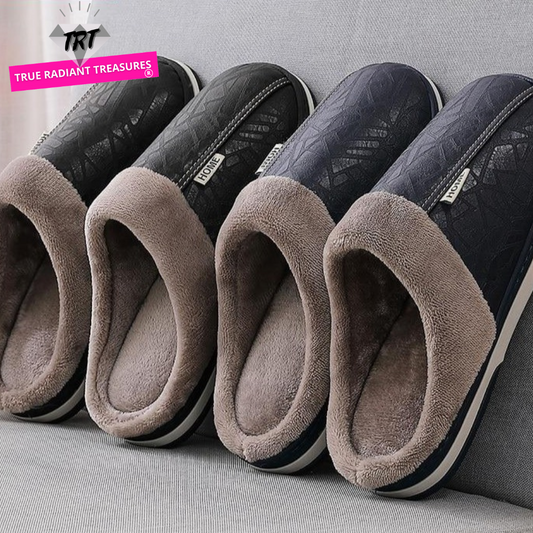 A pair of men's indoor slippers made of proportioned PU and plush insole material. The slippers are a light brown color and have a comfortable, relaxed design.