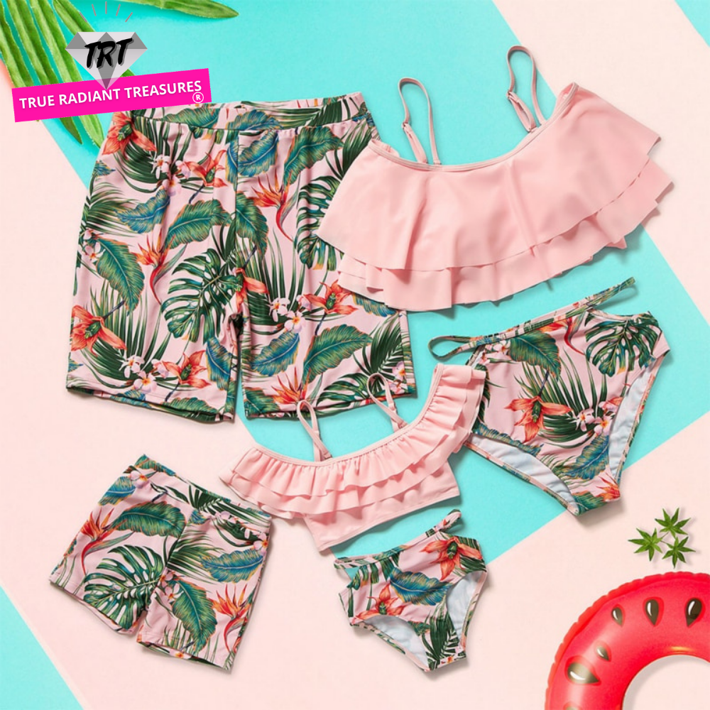 Image of Matching Pink Swimwear - Tropical-themed swimwear for the whole family. Made of comfortable polyester. Perfect for summer getaways and beach days. Get yours now and create unforgettable memories!