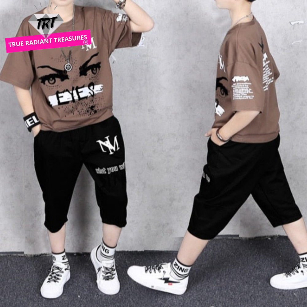 Image of a boy wearing a cartoon T-shirt and short pants set, made from a comfortable and durable blend of cotton and spandex. Perfect for active boys during playtime and sports activities. Fun and stylish designs available in multiple sizes for a perfect fit.